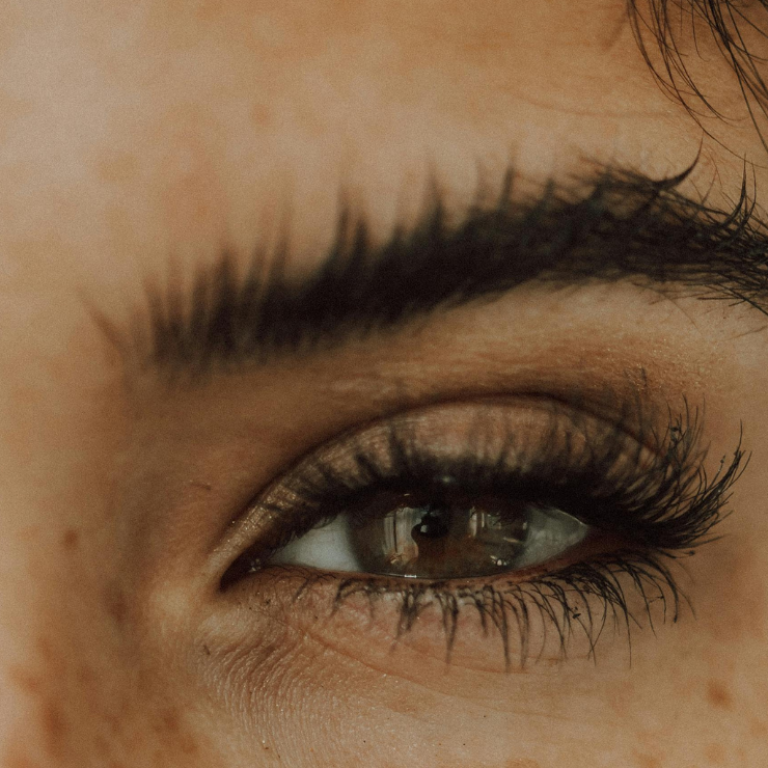 woman with lash extensions staring at camera